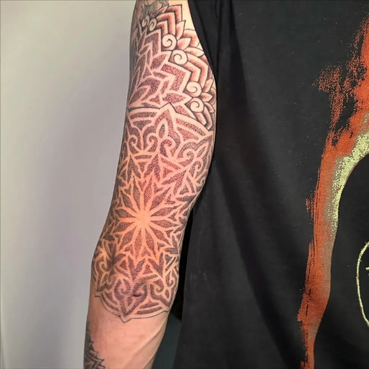 Medium Dotwork Mandala Tattoo on Men Upper Arm by @ryanholdentattoos