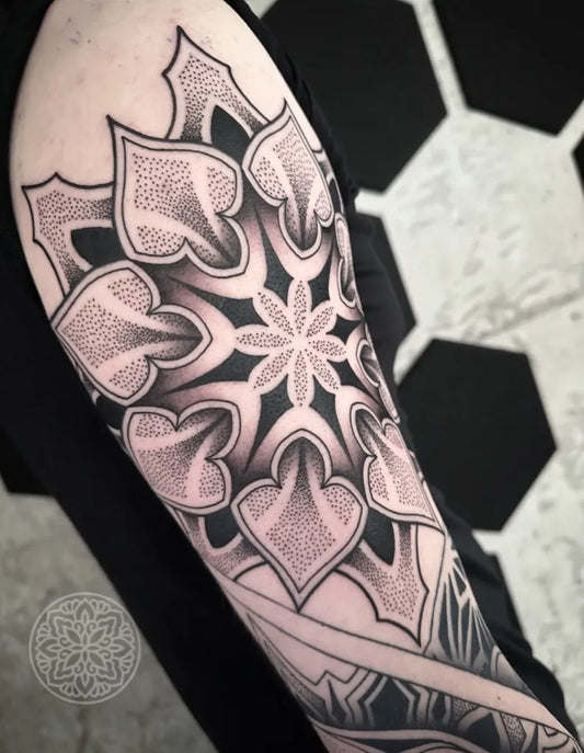 Medium Dotwork Mandala Tattoo on Men Upper Arm by @tattoosby.newyork