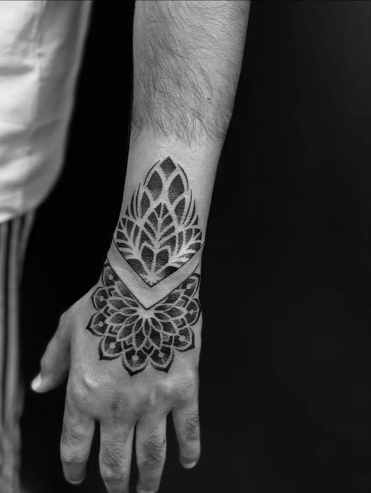 Medium Dotwork Mandala Tattoo on Men Wrist by @skinmachinetattoo