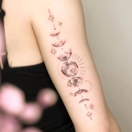 Medium Dotwork Moon Phases Stars Tattoo on Women Arm by @9dotstattoo