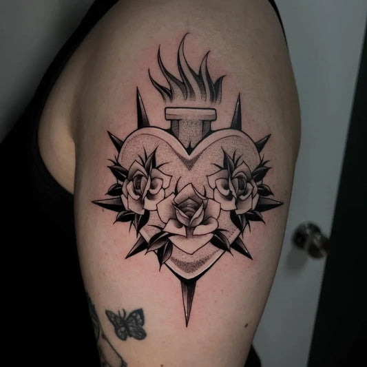 Medium Dotwork Sacred Heart with Thorns and Roses Tattoo on Women Upper Arm by @xen.inkz