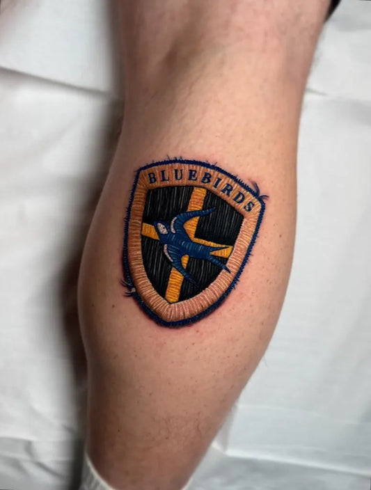 Medium Embroidery Bluebirds Shield Tattoo on Men Leg by @_richmccann