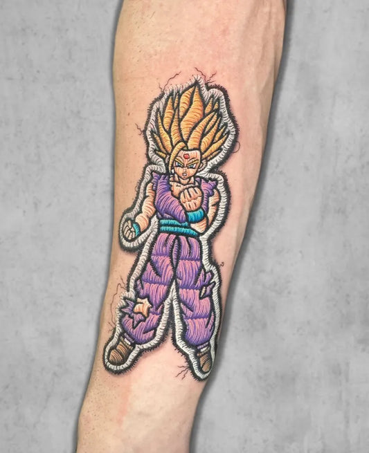 Medium Embroidery Goku Tattoo on Men Arm by @noemi.bb.tattoo