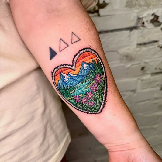 Medium Embroidery Heart Mountain Lake Tattoo on Women Arm by @vskywalkers