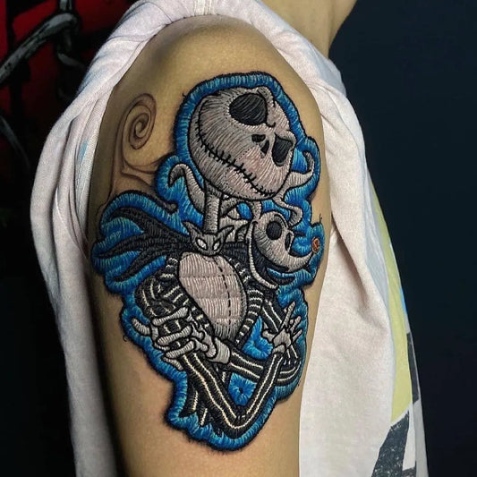 Medium Embroidery Jack Skellington and Zero Tattoo on Men Shoulder by @tattufreak