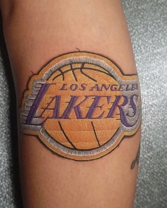 Medium Embroidery Lakers Logo Tattoo on Women Arm by @pintadon_tattoo