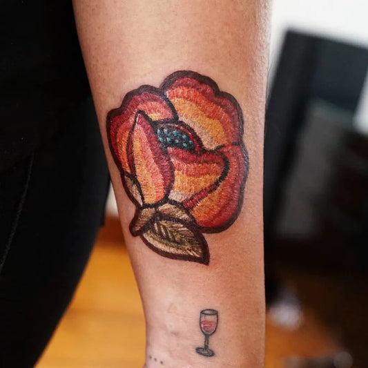 Medium Embroidery RedRoseWithLeafAndWineGlass Tattoo on Women Arm by @ksuarrow_tattoo