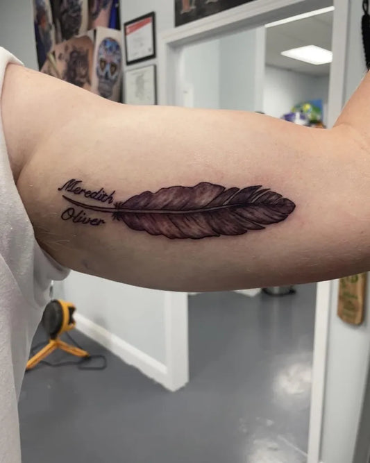 Medium Feather Realistic Feather Names on Women Arm Tattoo by @creative_pain_tattoo
