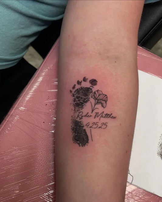 Medium Fine Line Baby Footprint with Flowers and Name on Women Arm Tattoo by @inkedbyslice