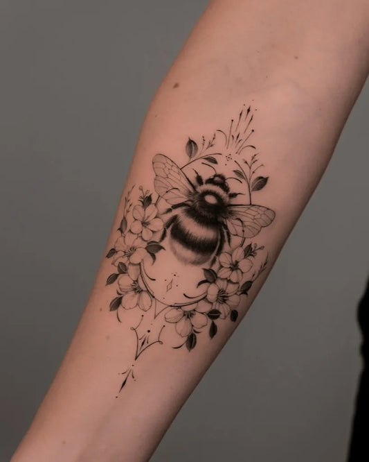 Medium Fine Line Bee and Flowers on Women Arm Tattoo by @ela_tattoo_artist_