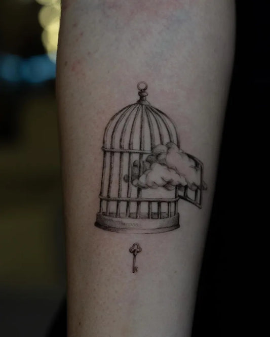 Medium Fine Line Birdcage with Cloud and Key Tattoo on Women Arm by @mickey.ontheclouds