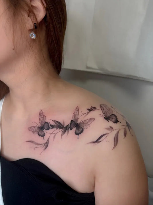 Fine Line Butterflies and Leaves on Women Shoulder Tattoo by @thebee.tt