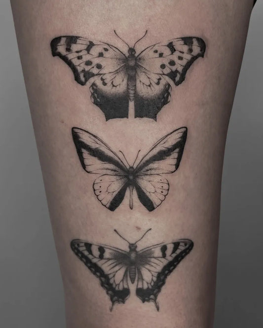 Fine Line Butterflies on Women Thigh Tattoo by @kavi_tattoo