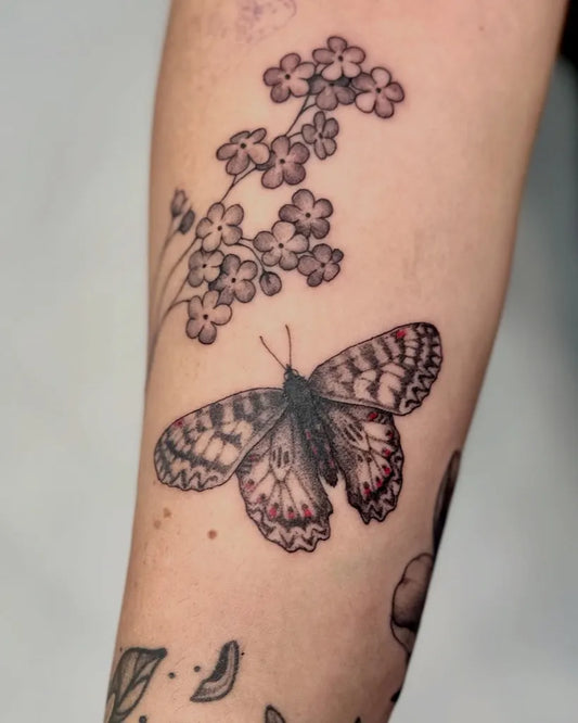 Fine Line Butterfly and Forget Me Not on Women Upper Arm Tattoo by @papa.rak