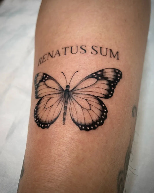 Fine Line Butterfly and Quote on Women Arm Tattoo by @himma.tattoo