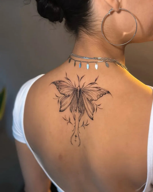 Fine Line Butterfly on Women Back Tattoo by @guiotaviotattoo