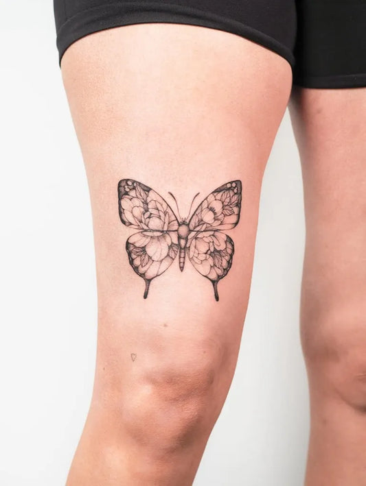 Fine Line Butterfly on Women Thigh Tattoo by @inkingcali