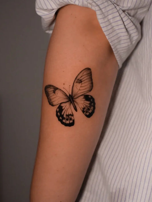 Fine Line Butterfly on Women Upper Arm Tattoo by @maxlopezg