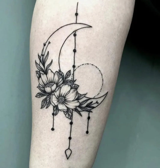 Medium Fine Line Crescent Moon and Flowers Tattoo on Women Forearm by @moortattoos