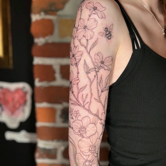 Medium Fine Line Daffodil and Bee Tattoo on Women Arm by @peaceflowertattoo