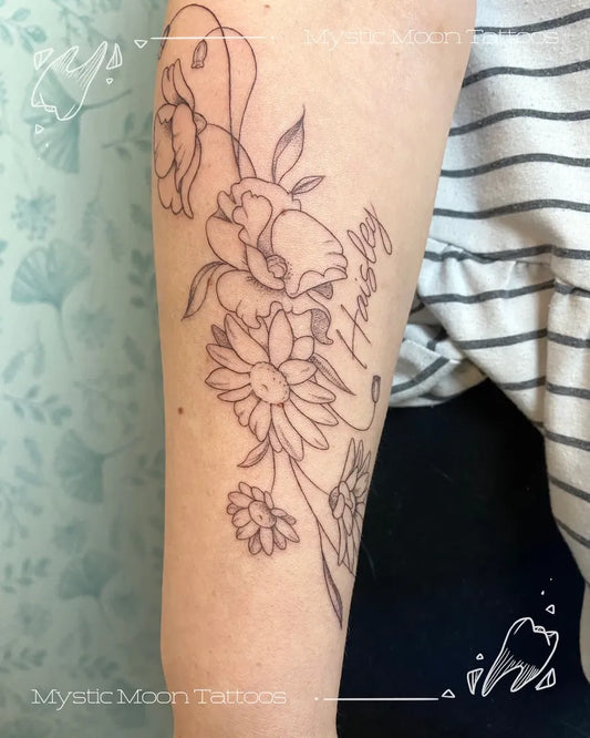 Medium Fine Line Daisy Flowers and Name Tattoo on Women Arm by @mysticmoontattoos