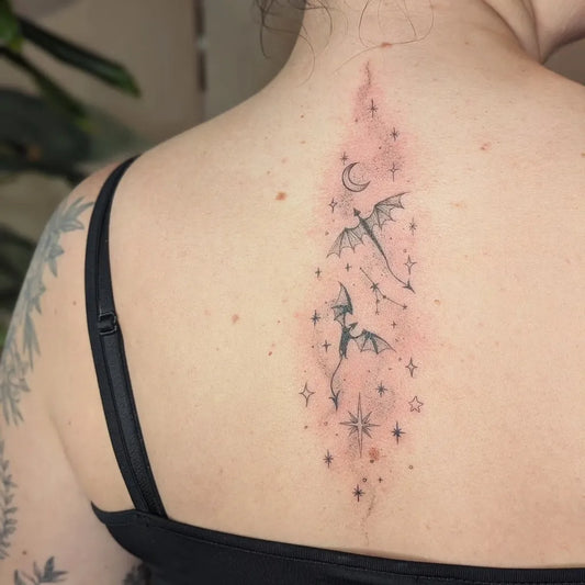 Medium Fine Line Dragons and Moon and Stars Tattoo on Women Back by @takeme2atlantis
