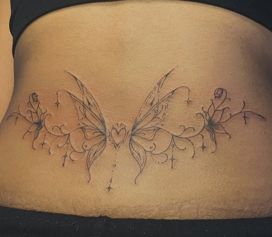 Medium Fine Line Fairy Wings and Roses Tattoo on Women Lower Back by @kilobytegirl