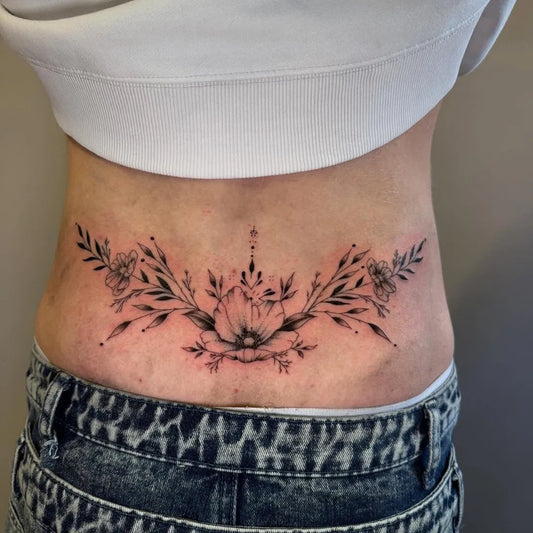 Medium Fine Line Floral Bouquet Tattoo on Women Lower Back by @weronika.inkss
