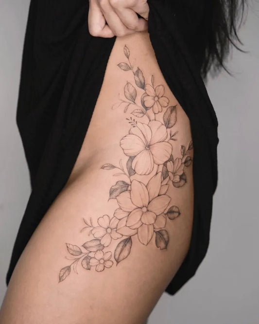 Medium Fine Line Floral Cluster Tattoo on Women Hip by @vivianatattoo