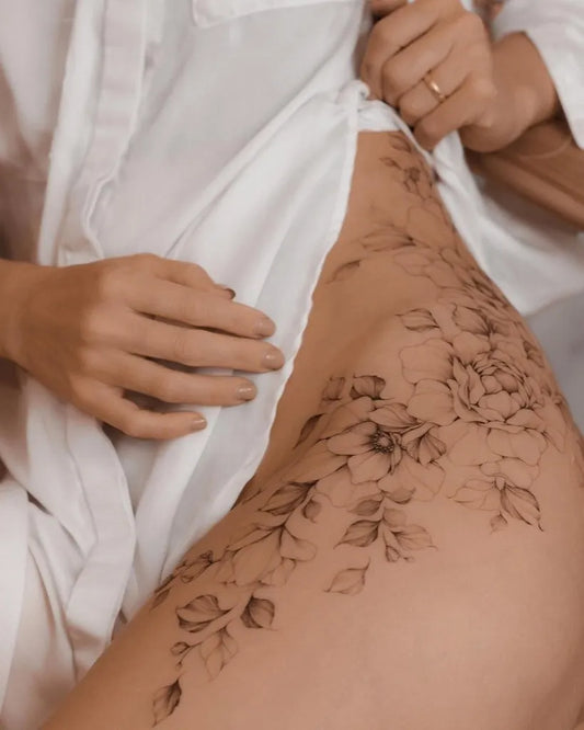 Medium Fine Line Floral Vines Tattoo on Women Hip by @odyssee.studios