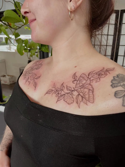 Medium Fine Line Flowers Tattoo on Women Collarbone by @tessajoytattoos
