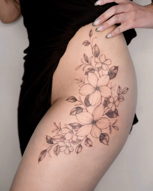 Medium Fine Line Flowers Tattoo on Women Hip by @vivianatattoo