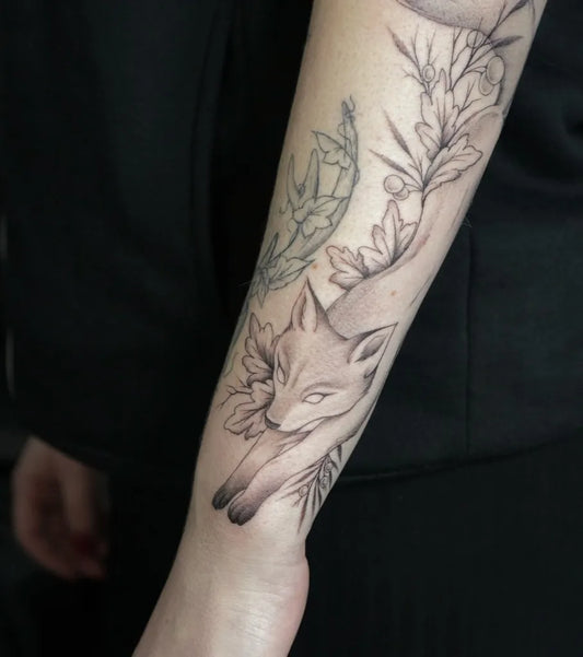 Medium Fine Line Fox and Flowers Tattoo on Women Arm by @neringa_tattoo