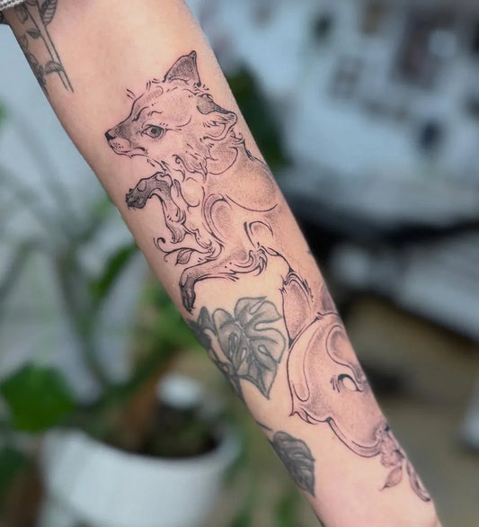 Medium Fine Line Fox and Monstera Tattoo on Women Arm by @skyesnake.ink
