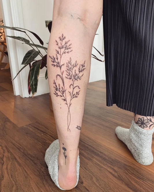 Medium Fine Line Grass Tattoo on Women Calf by @jasmineferntattoo