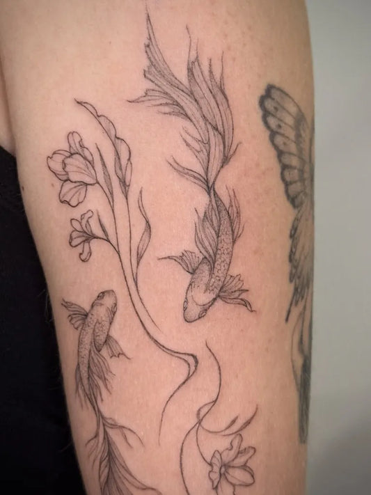 Medium Fine Line Koi Fish Tattoo on Women Arm by @annalatacztattoo
