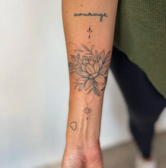 Medium Fine Line Lotus Flower Courage Script on Women Forearm Tattoo by @cecilyelmas