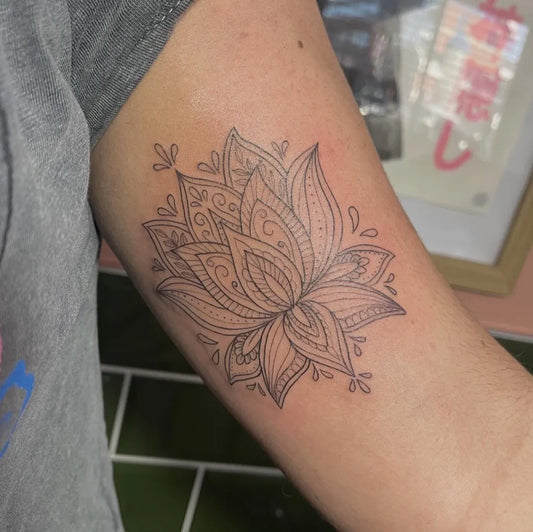 Medium Fine Line Lotus Tattoo on Women Inner Arm by @sophytattoo
