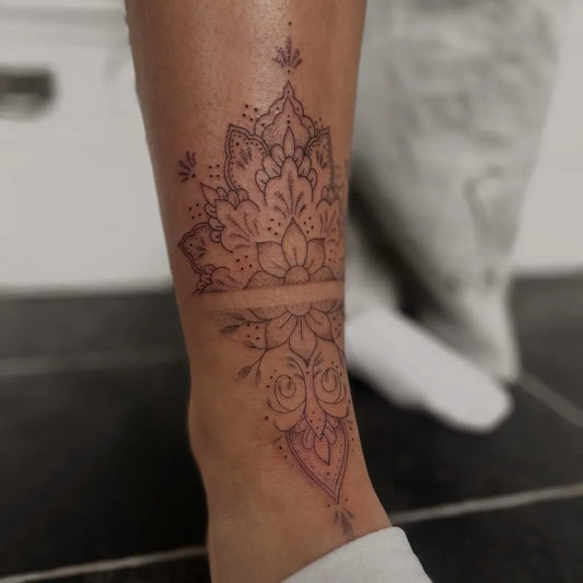 Medium Fine Line Mandala Floral Tattoo on Women Ankle by @ferne.kirkbytattoo