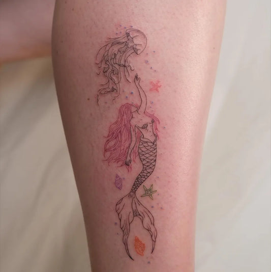 Medium Fine Line Mermaid Starfish Tattoo on Women Leg by @ecesutattooart