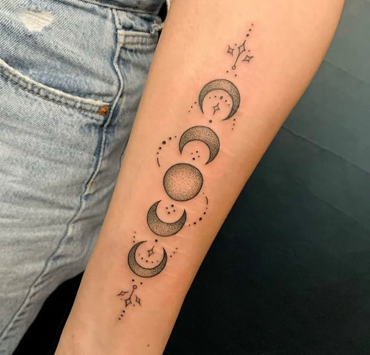 Medium Fine Line Moon Phases Tattoo on Women Arm by @jolie_rouge_tattoo