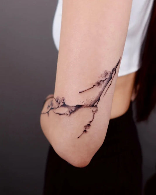 Medium Fine Line Plum Branch on Women Arm Tattoo by @minaa.ink