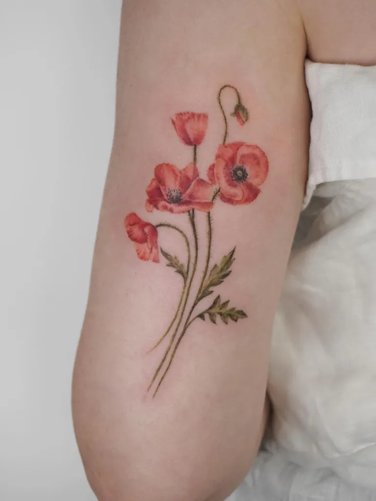 Medium Fine Line Poppy Flowers Tattoo on Women Arm by @roberta.tattooartist