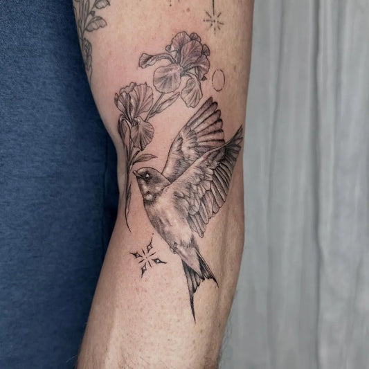 Medium Fine Line Sparrow and Iris Tattoo on Men Arm by @bekah_beatty