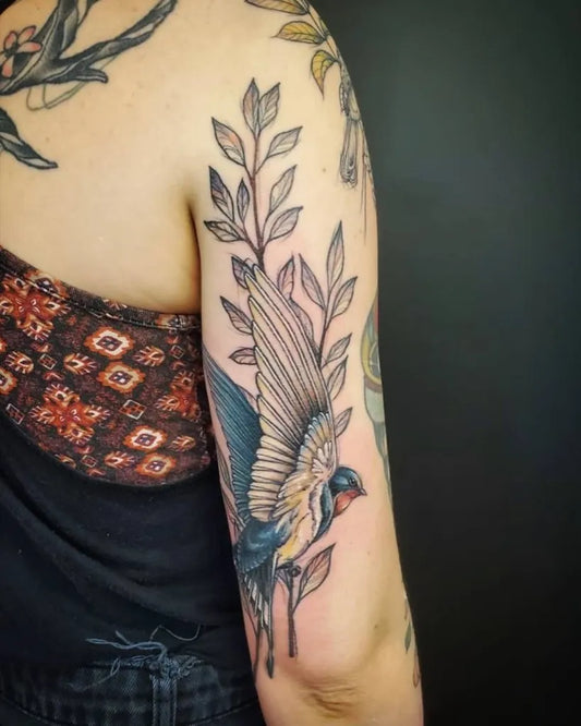 Medium Fine Line Sparrow and Leaves Tattoo on Women Arm by @pretty.sketchy.lines