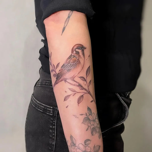 Medium Fine Line Sparrow with Branches and Flowers Tattoo on Women Arm by @blondi_ink