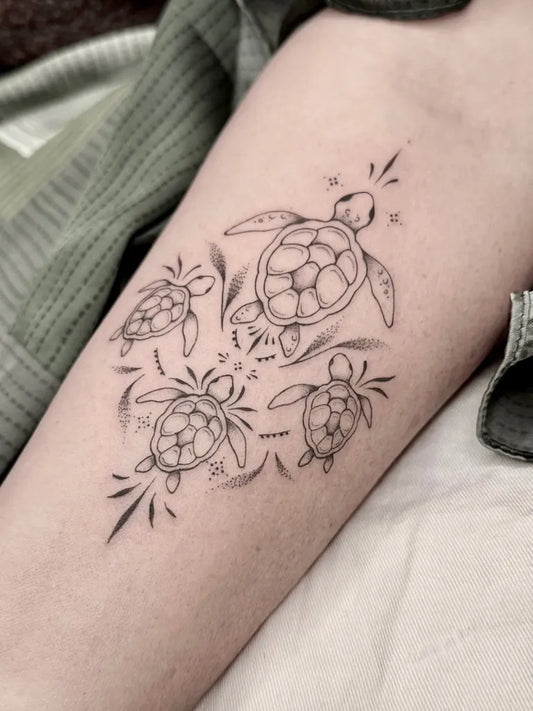 Medium Fine Line Turtle Family Tattoo on Women Arm by @bohemian_flash_tattoo
