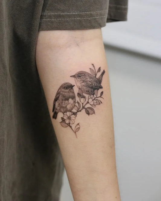 Medium Fine Line Two Birds with Branch Tattoo on Women Arm by @kyla_rose_tattoo