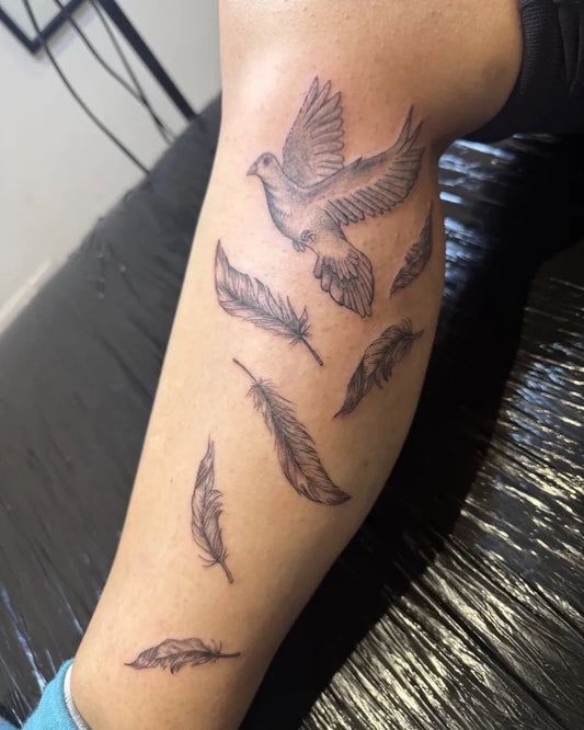 Medium FineLine Dove and Feathers on Women Thigh Tattoo by @inked_byjaz_