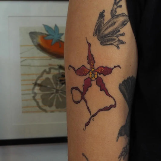 Medium FineLine Orchid Frog Tattoo on Women Arm by @hayley_web